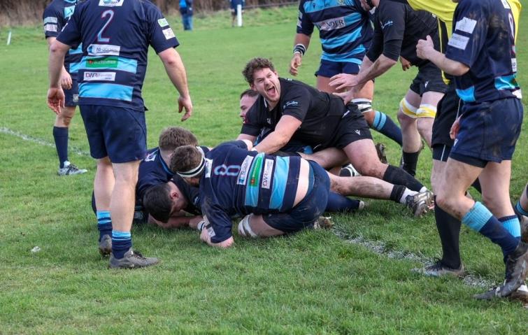 Luke Griffiths-Dawes claims a Neyland try